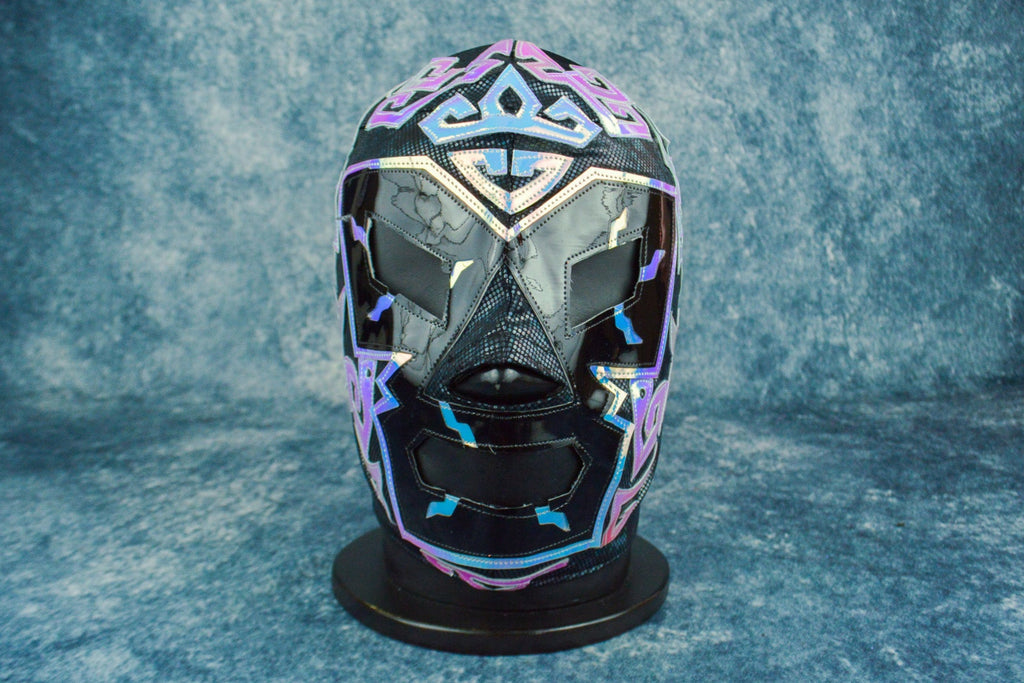 Colorful mask on a stand against a gray background